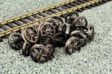 Metal spoked model railway wheels with axles in 00 gauge or 1/76 scale - obrazy, fototapety, plakaty