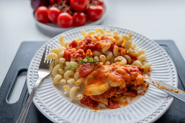Baked turkey with mozzarella and tomato sauce on a plate