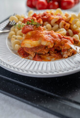 Baked turkey with mozzarella and tomato sauce on a plate