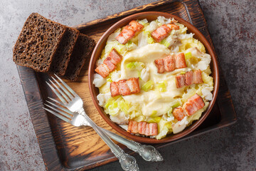 Norwegian Plukkfisk is made with a white fish cod and a creamy potato close up on a plate on the table. Horizontal top view from above