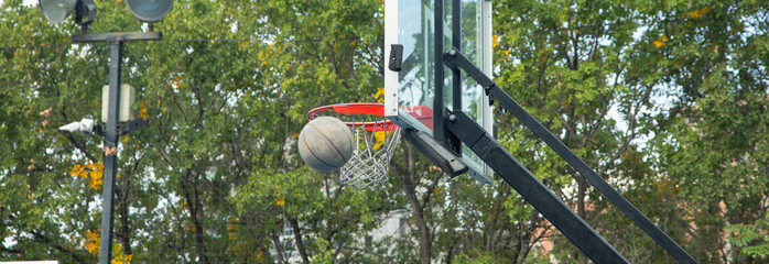 Ball in basketball hoop. Sport. Hobby. Lifestyle
