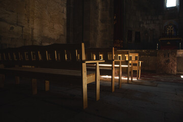 Bench at the church. Sun shines inside