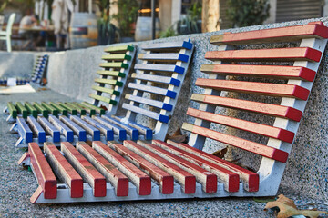 Colored benches in the city square. Musical concept