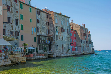 Historic houses on the north east waterfront of the medieval coastal town of Rovinj in Istria,...