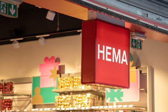 hema shop sign text entrance and brand logo red store front boutique in street