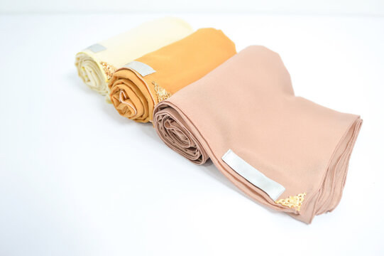 Shawls folded on white background. Muslimah religious symbol. Close up prayer shawl.