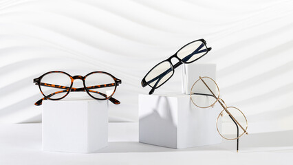 Trendy eyeglasses in plastic and metallic frame on a white background. Close up. Sunglasses and...