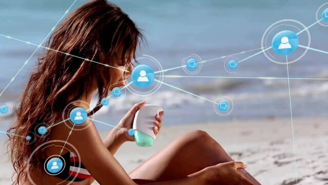 Animation of connected profile icons over biracial girl applying lotion before sunbath at beach