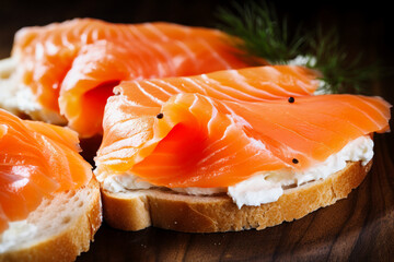 Sandwich made of fresh salmon and bread close-up. Lightly salted fish with fresh herbs and butter. Dietary healthy food.