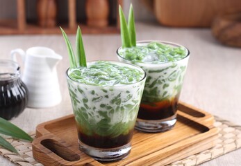 Cendol is a sweet dessert that contains droplets of green rice flour jelly, coconut milk and palm sugar syrup. It is served with shaved ice and is a refreshing snack in hot weather. 