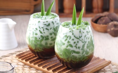 Cendol is a sweet dessert that contains droplets of green rice flour jelly, coconut milk and palm sugar syrup. It is served with shaved ice and is a refreshing snack in hot weather. 