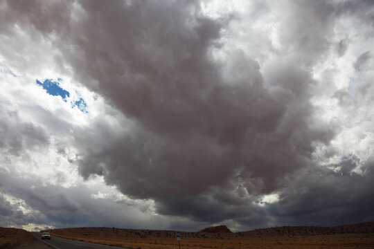 A huge dark cloud on the road