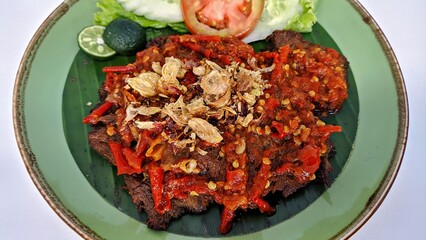 Jakarta, Indonesia - August 29, 2023: Close Up Gepuk is a Traditional Indonesian Food Made from Beef with a Sweet and Savory Taste, Usually Called Empal too. Gepuk Means Squash the Beef until Tender. 