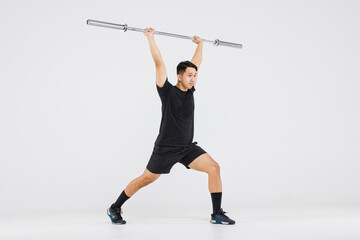 Portrait isolated cutout full body studio shot strong Asian male fitness athlete sportman model in black casual sport workout outfit posing smiling lifting barbell exercising on white background