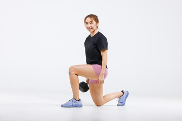 Portrait isolated cutout full body studio shot strong Asian female fitness athlete sportswoman trainer model in casual sport workout outfit lunge training exercising with dumbbell on white background