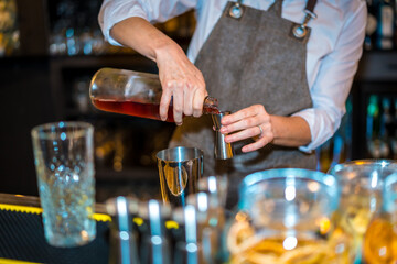 Close-up of bartender preparing a luxury cocktail