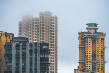 Aerial view of Mumbai city in Maharashtra, India. Beautiful cloudy weather during monsoon. Indian Cityscape.