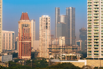 Aerial view of Mumbai city in Maharashtra, India. Beautiful cloudy weather during monsoon. Indian Cityscape.