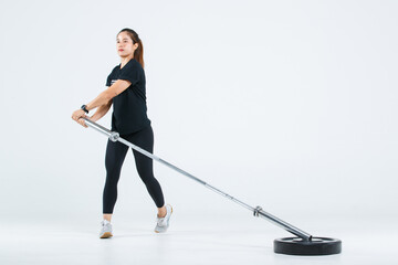 Isolated cutout full body studio shot of strong Asian female fitness athlete sportswoman trainer model in casual sport workout outfit posing training exercising lifting barbell on white background