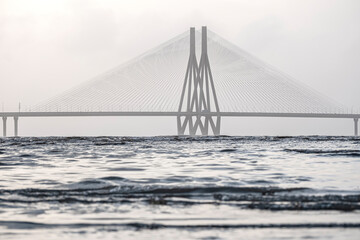 Aerial view of vehicles Passing over Bandra Worli Sea Link in Mumbai, India. Weather in Mumbai, Morning skyline Mumbai. Developing India concept. Longest Bridge in India.