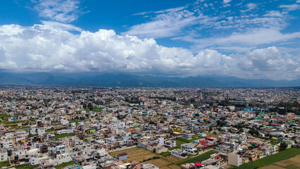 Aerial view of residential houses in Dehradun city, Uttarakhand. Top angle Drone shot, houses in a smart city, living in India.