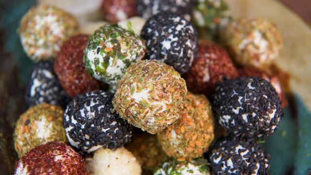 RECIPE FOR LABNEH CHEESE BOLLS WITH DRIED MINT, WHITE AND BLACK SESAME, SUMAC AND ZAATAR. High quality video