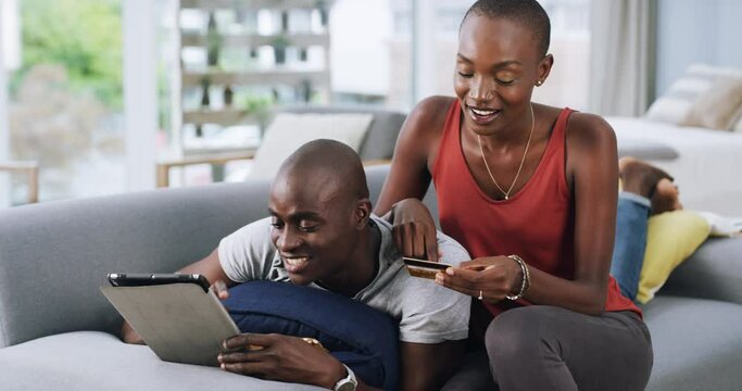 Tablet, love and couple on a sofa with credit card for bank, loan or ecommerce payment at home. Digital, app and black people on a living room for online shopping, search or sign up, password or deal