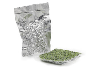 Aluminium bag with vacuumed hop granules and green hop granules packed in transparent packaging...