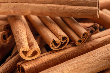 Cinnamon sticks against the background of a gray stone table.