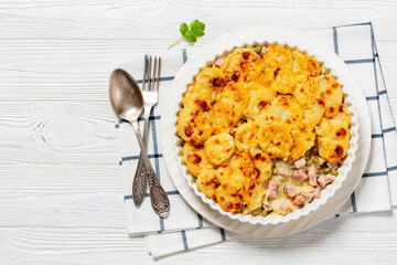 au gratin potatoes with diced ham and green peas