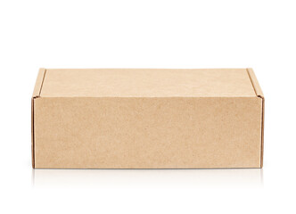 closed cardboard box highlighted on a white background.  With shadow and reflection