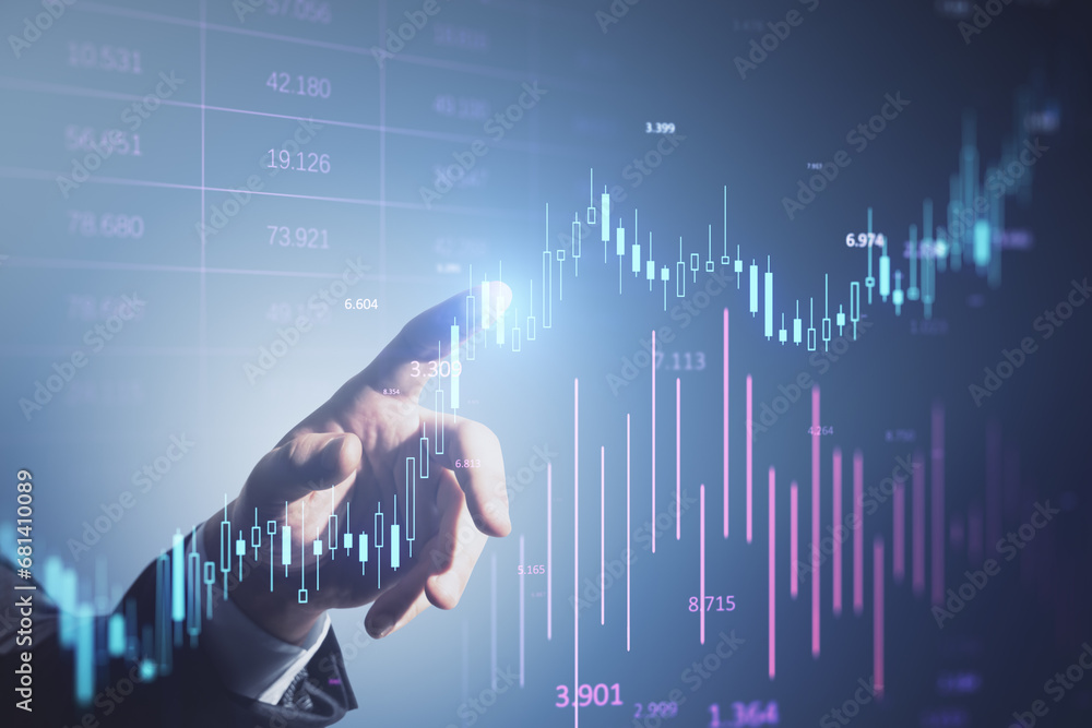 Poster hand interacting with stock market data on a digital screen