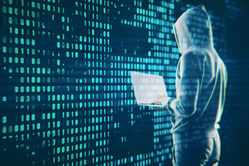 Hacker in hoodie using laptop with creative digital binary code dots hologram. Digital data hacking...