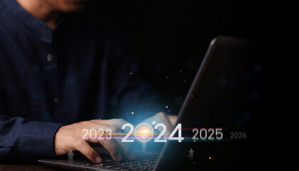 Countdown to 2024 concept. the taps a virtual download bar with a loading progress meter on New...