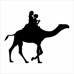 Silhouette of a woman riding a camel