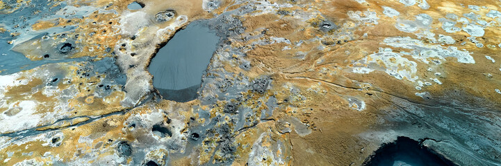 Hverir, Iceland. A surreal, bare orangy-red, geothermal area at the foot of Namafjall. Full of fumaroles, mud pools, steam vents. It's on Route 1. It is also called Namaskard Hverir.