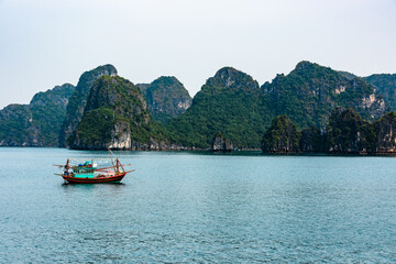 Fototapeta na wymiar Traditional fishing boat on Halong Bay, Vietnam