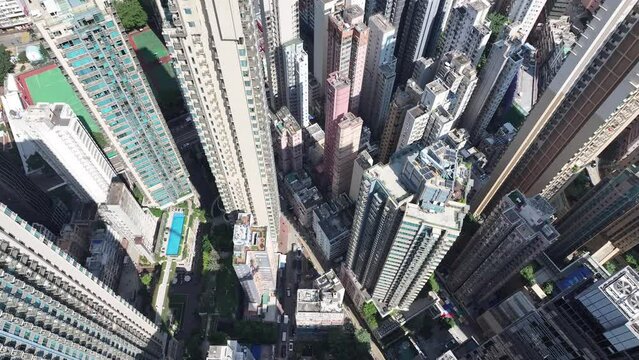 Drone Skyview in Hong Kong 4K Aerial shot of the Wan Chai Central Admiralty Causeway Bay Happy Valley CBD in financial commercial business along the sides of the Victoria Harbour