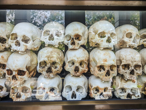 Some of the 9000 skulls piled up inside the Memorial Stupa to the victims at the Choeung Ek Killing Fields Genocide Centre, Phnom Penh, Cambodia