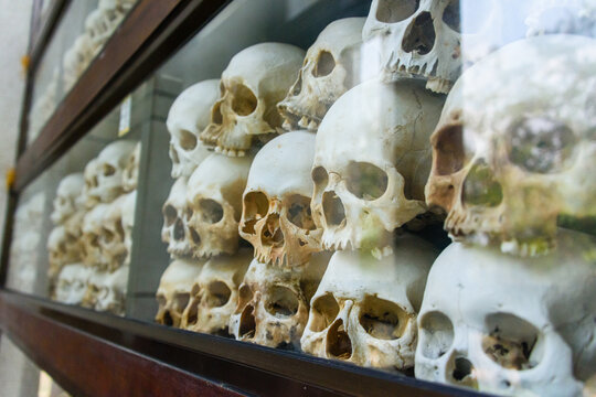 Some of the 9000 skulls piled up inside the Memorial Stupa to the victims at the Choeung Ek Killing Fields Genocide Centre, Phnom Penh, Cambodia