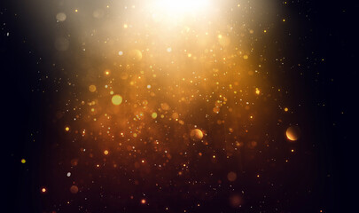 abstract black background with gold flecks, flash of light