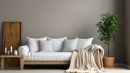 single white sofa with pillows and blanket against blank wall, modern interior design