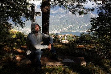 handsome man in a beautiful view taking photos of mountainous landscapes