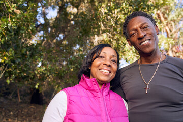 Adult Senior Black Couple Walking on Hiking Trail in Nature
