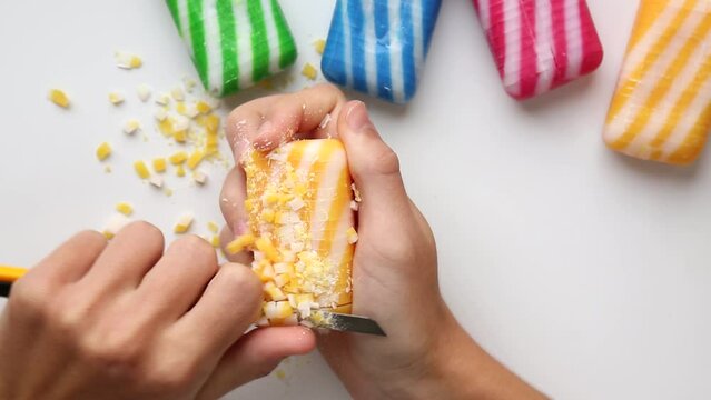 Cutting ASMR soap with a thin stationery knife .Cutting soap into pieces squares