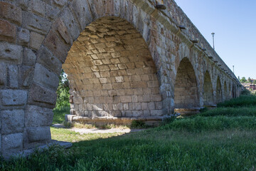 Cityscape , Arches of the Roman Bridge or Puente Mayor del rio Tormes, Salamanca, Spain