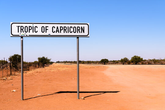 Naklejki Road sign at the tropic of capricorn  on the road from Windhoek to Rehoboth, Namibia.