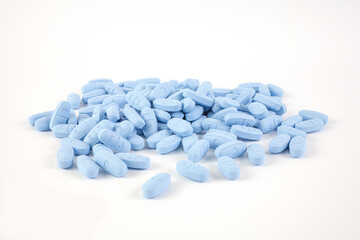 Blue pills on the white background