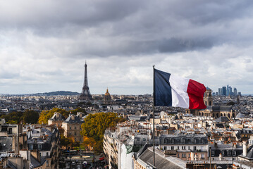 Paris skyline panorama with the Eiffel Tower and French flag