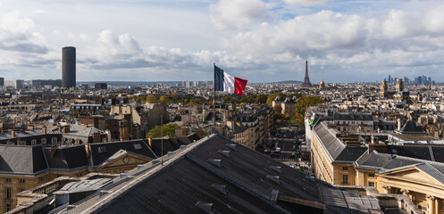 Paris skyline panorama with the Eiffel Tower and French flag